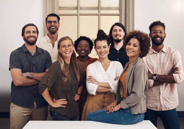 portrait of a group of businesspeople standing together in an office